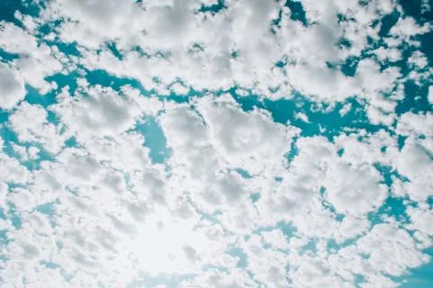 Many white clouds in the blue dramatic sky Stock Photos
