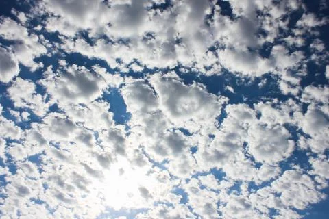 Many white clouds in the blue dramatic sky Stock Photos