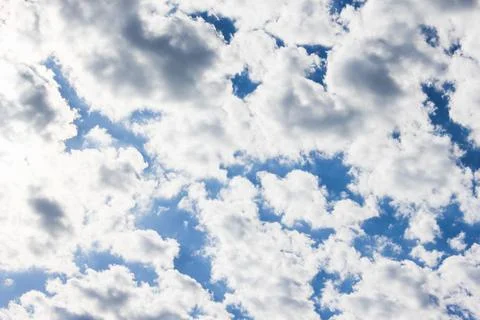 Many white clouds in the blue dramatic sky Stock Photos