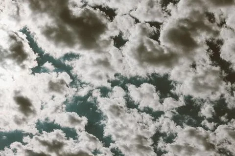 Many white clouds in the blue dramatic sky Stock Photos