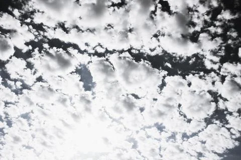 Many white clouds in the blue dramatic sky Stock Photos