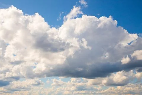 Many white clouds in summer blue sky. Stock Photos