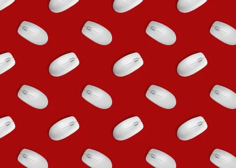 Many white computer mouses on red background, flat lay. Seamless pattern desi Stock Photos