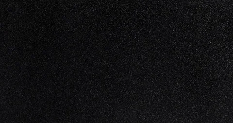 Many white dust particles ascending and descending slowly on black background Stock Footage 113637342
