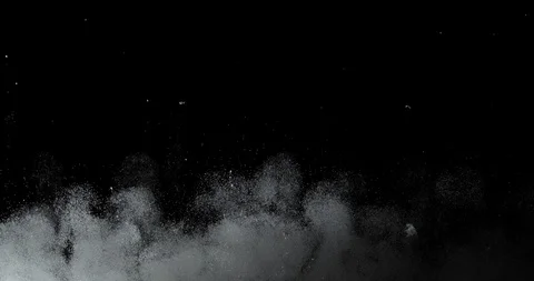 Many white dust particles like from an explosion ascending on black background Stock Footage 113622274