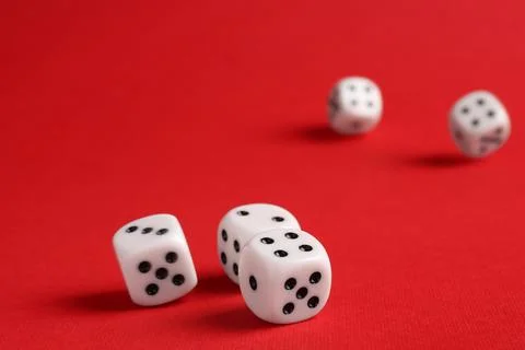 Many white game dices falling on red background. Space for text Stock Photos