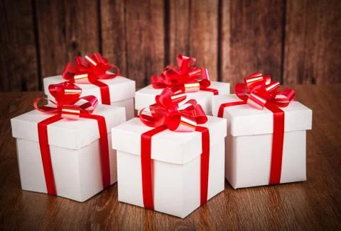 Many white gift boxes on a wood background Stock Photos