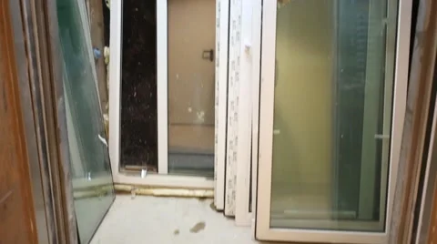 Many white glazed windows stand in freight elevator in residential building Stock Footage 49711541