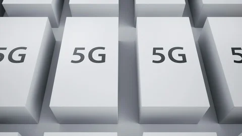 Many white glossy boxes for devices on white background, 5g symbol on top. 動画素材 117850796