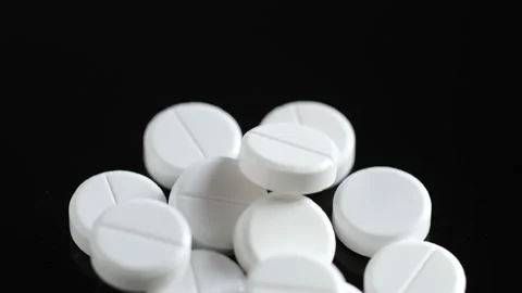 Many white round pills. Pharmaceutical production. Drugs on the production line Stock Footage 170035692
