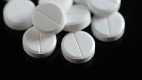 Many white round pills. Pharmaceutical production. Drugs on the production line Stock Footage 171307520