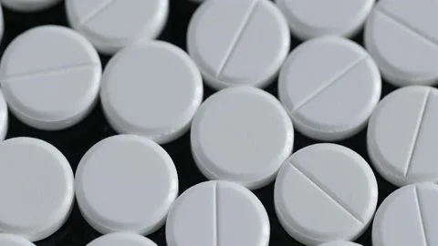 Many white round pills. Pharmaceutical production. Drugs on the production line Stock Footage 172234493