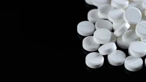 Many white round pills. Pharmaceutical production. Drugs on the production line Stock Footage 172461365