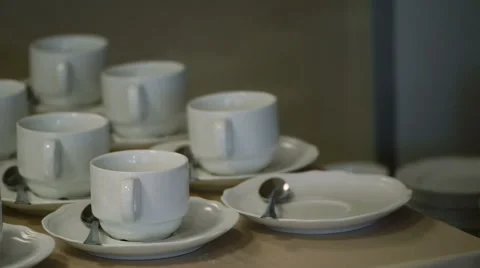 Many White Tea Cups in Table Stock Footage 58356847