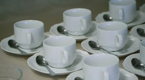 Many White Tea Cups in Table Stock Footage 58356907