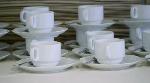 Many White Tea Cups in Table Stock Footage 58356931