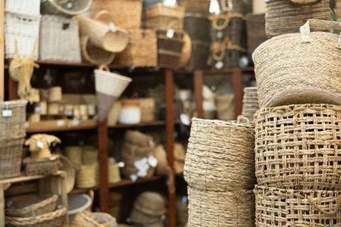 Many wicker baskets displayed in store Stock Photos