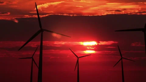Many wind mills against red sunset - HD Stock Footage 45967862
