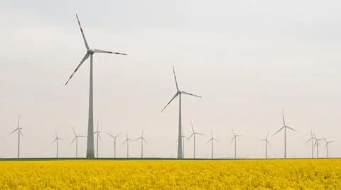 Many windmills rotating during windy spring cloudy day Stock Footage 62497257