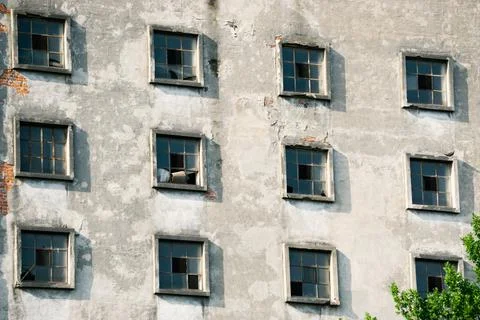 Many windows on the facade of the old building. Monotone architecture Stock Photos