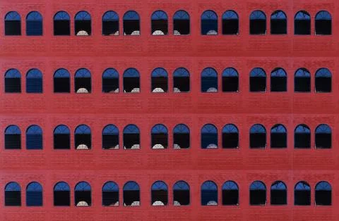 Many windows on old red brick wall,background 写真素材