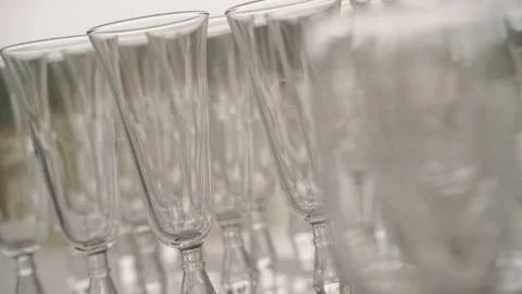 Many wineglasses are on table in open air during festive event outside. Stock Footage 148007847