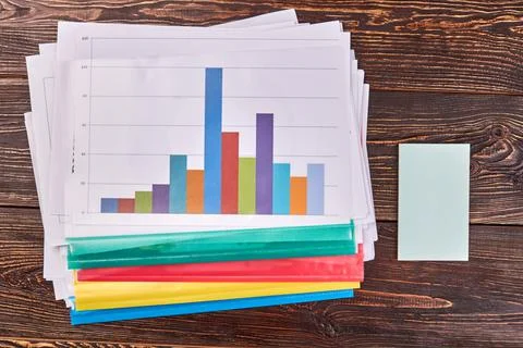 Many work papers with statistic and blank paper. Stock Photos