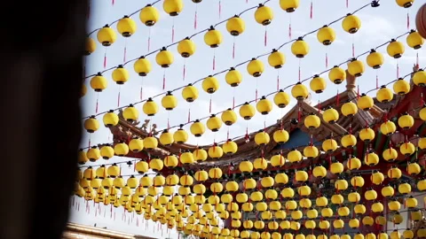 Many yellow lanterns at religious temple Stock Footage 229777915