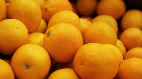 Many yellow lemon close up rotating on a 4K background in store for buyer. Stock Footage 116790693
