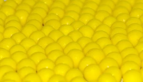 Many yellow round dragees of ascorbic acid vitamin C isolated on white back.. Stock Photos