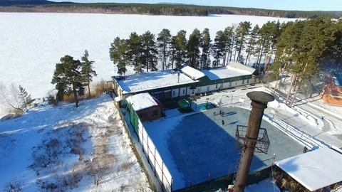 Many young people are skating on ice rink at winter t. Aerial view Stock Footage 87473779