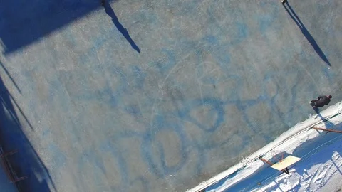 Many young people are skating on ice rink at winter t. Aerial view Stock Footage 87474706