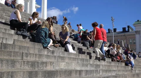 Many young people sit on the steps in front of the Cathedral in Helsinki. Stock Footage 67469755