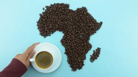 Map of the Africa made of roasted coffee beans with coffee cup Stock Footage 104795565