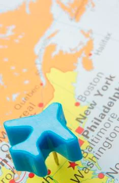 Map of america with model push pin plane over new york Stock Photos
