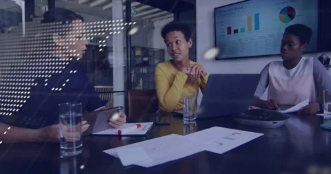 Map and code overlay drifting across camera, revealing business team reviewing Video stock 331006028