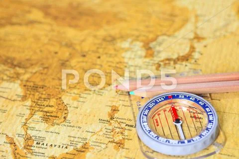 Map and compass Stock Photos