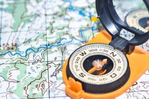 Map and compass. Stock Photos
