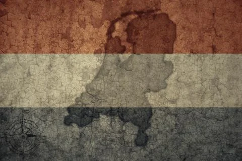 Map and flag of netherlands on a old vintage crack paper background . Stock Photos