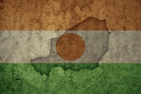 Map and flag of niger on a old vintage crack paper background . Stock Photos