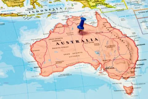 Map of australia with a white pushpin stuck Stock Photos
