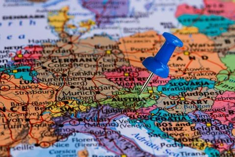 Map of Austria with a blue pushpin stuck Stock Photos