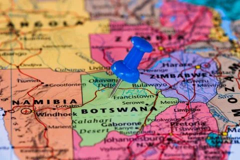 Map of Botswana with a blue pushpin stuck Stock Photos