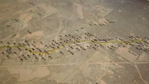 Map- camera scrolling over detailed map of highway, lots and land forms, 4k Video stock 253421443