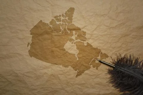 Map of canada on a old paper background with old pen Stock Photos