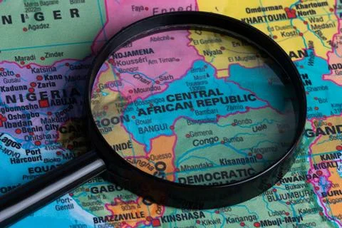 Map of Central African Republic through magnifying glass.Close-up. Stock Photos