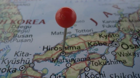 Map close up of a pin in nuclear bombed city Hiroshima Stock Footage 124233630