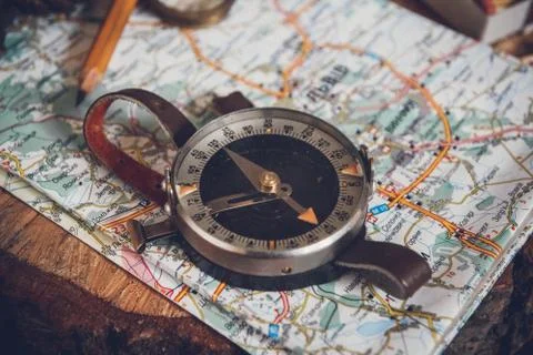 Map with compass. Simple navigation tools to orient in the world Stock Photos