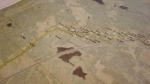 Map - detail, camera scrolls over map showing lots and highway, 4k Stock Footage 253421485