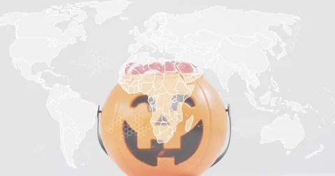 Map fading behind pumpkin pail, outlining Africa, animating honeycomb patterns Video stock 317835324